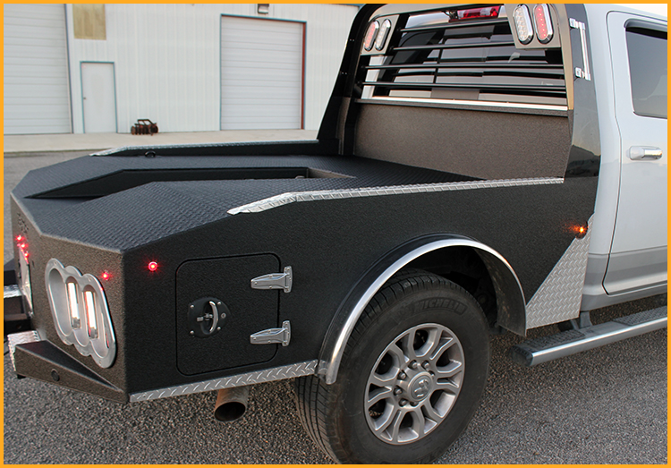 Bobtail goose-neck trailer hauler sprayed with GatorHyde on the bumper, sides and bed