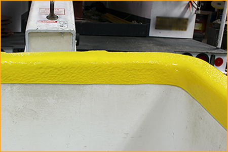 Utility truck boom bucket trim sprayed with GatorHyde.