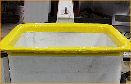 Utility truck boom bucket trim sprayed with GatorHyde.