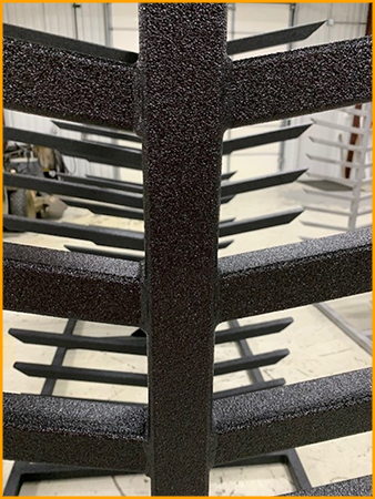  Steel racks are spray coated with a polyurea coating.