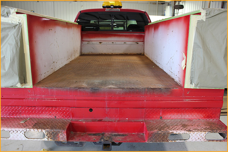 Used utility truck bed masked off.