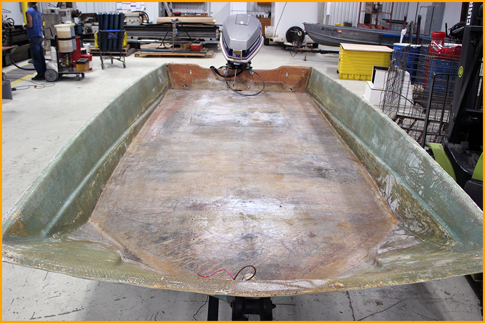 Interior of aluminmum boat sanded and wiped down.